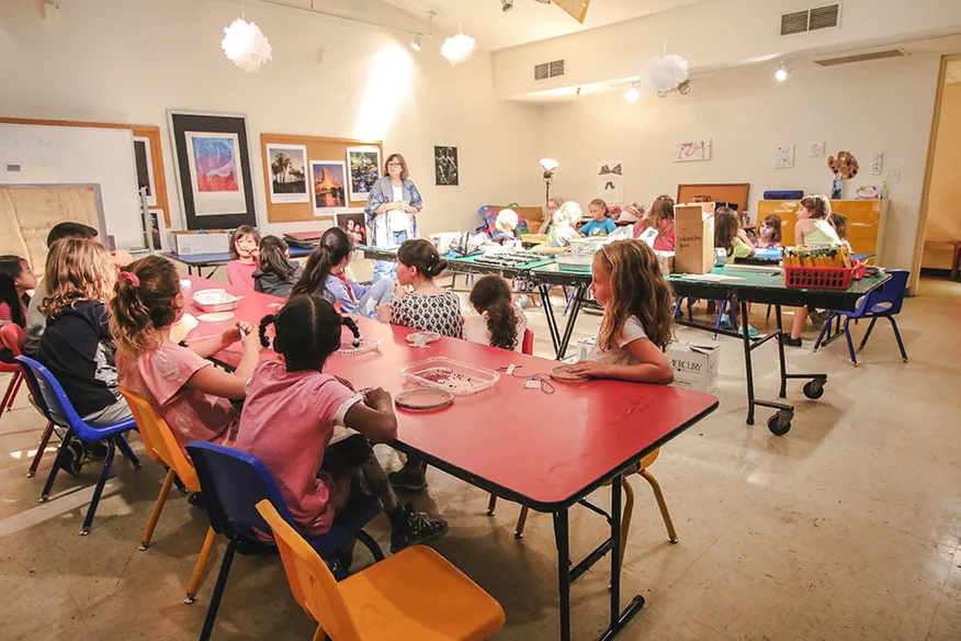a group of children participating in summer art camp at the orlando museum of art