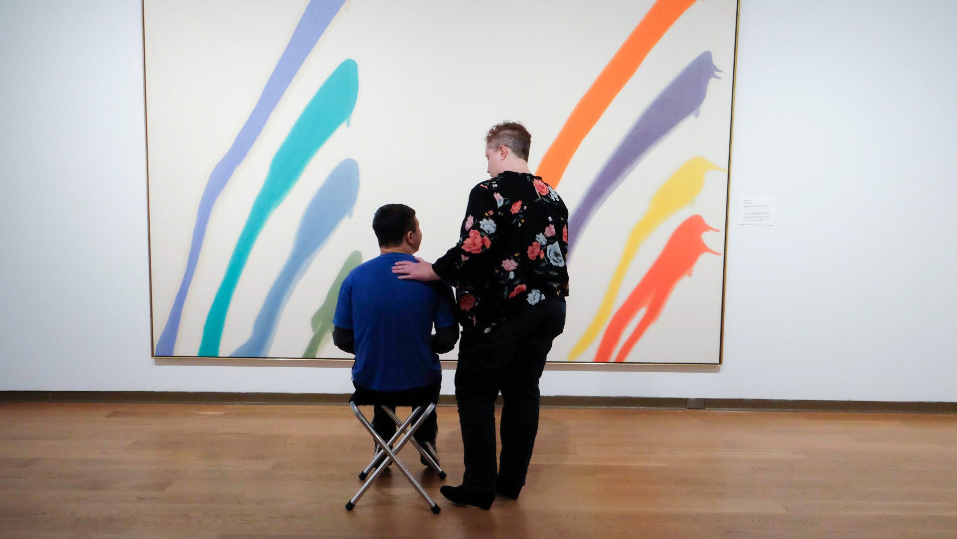 creative connections community program goers looking at paintings