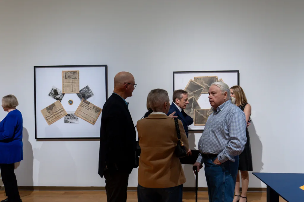 Dennis Scholl talking with museum visitors about his "A Day of Four Sunsets" exhibition.
