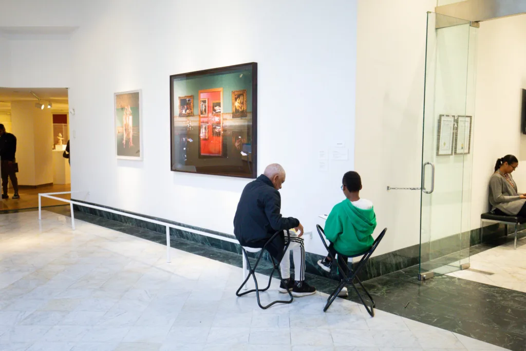 guests sketching in the galleries during Access for All at OMA