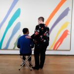 creative connections community program goers looking at paintings