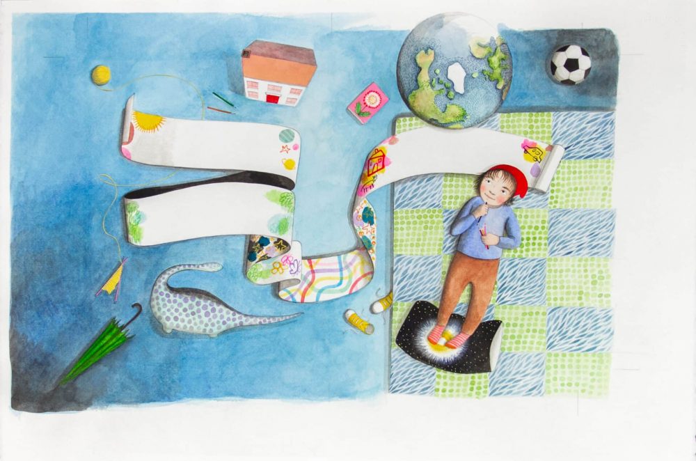 Child lying on mat with a banner, dino, umbrella, house, globe, soccer ball around him