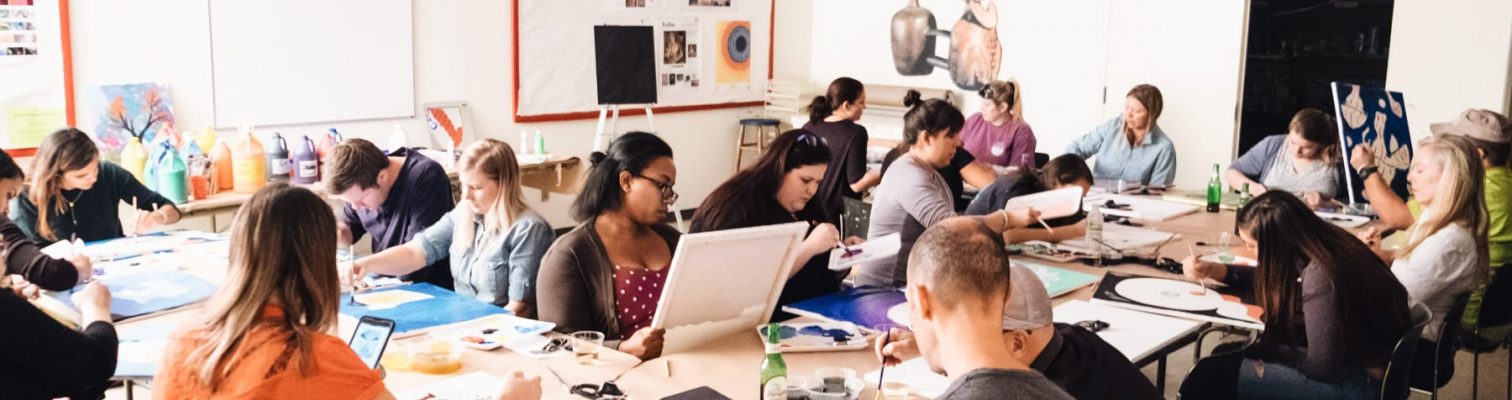 Couples in an adult painting class during Art Night Out at OMA.