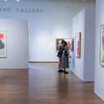 A couple on a date in an art gallery.