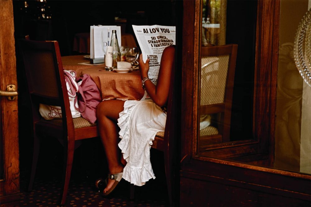 PERMITTED USE: This image may be downloaded or is otherwise provided at no charge for one-time use for coverage or promotion of the National Geographic exhibit "Women of Vision” and exclusively in conjunction thereof.  Copying, distribution, archiving, sublicensing, sale, or resale of the image is prohibited.

REQUIRED CREDIT AND CAPTION: Any and all image uses must  (1) be properly credited to the relevant photographer, as shown in this metadata, and (2) be accompanied by a caption that makes reference to the National Geographic exhibit "Women of Vision.”

DEFAULT: Failure to comply with the prohibitions and requirements set forth above will obligate the individual or entity receiving this image to pay a fee determined by National Geographic.

JODI COBB
A woman in Florence, Italy, savors the message on a large greeting card.